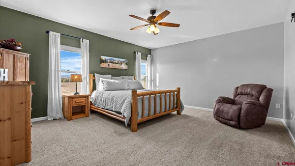 a bed room with a bed and a chandelier