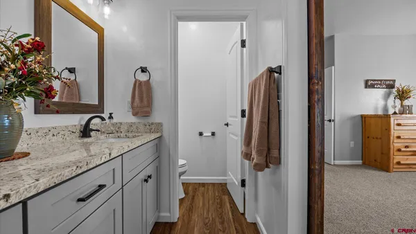 a view of walk in closet with clothes