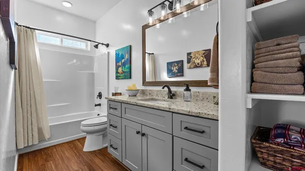 a kitchen with a refrigerator and a sink