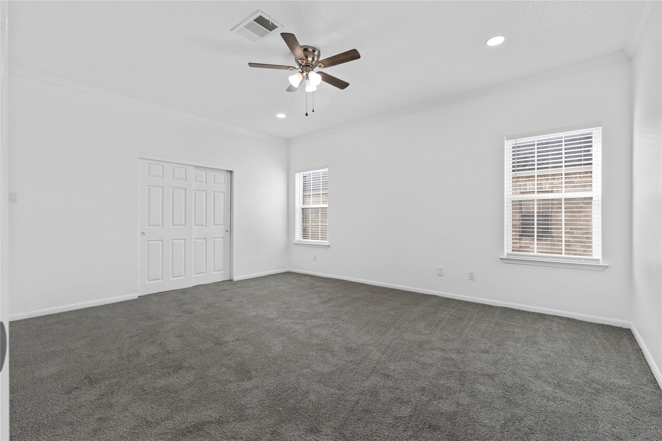 6000 Reims Road, Unit 2005 Houston, TX 77036 - Photo 16 of 28 an empty room with windows and fan