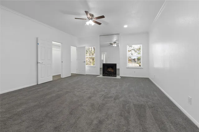 a view of empty room with a fireplace