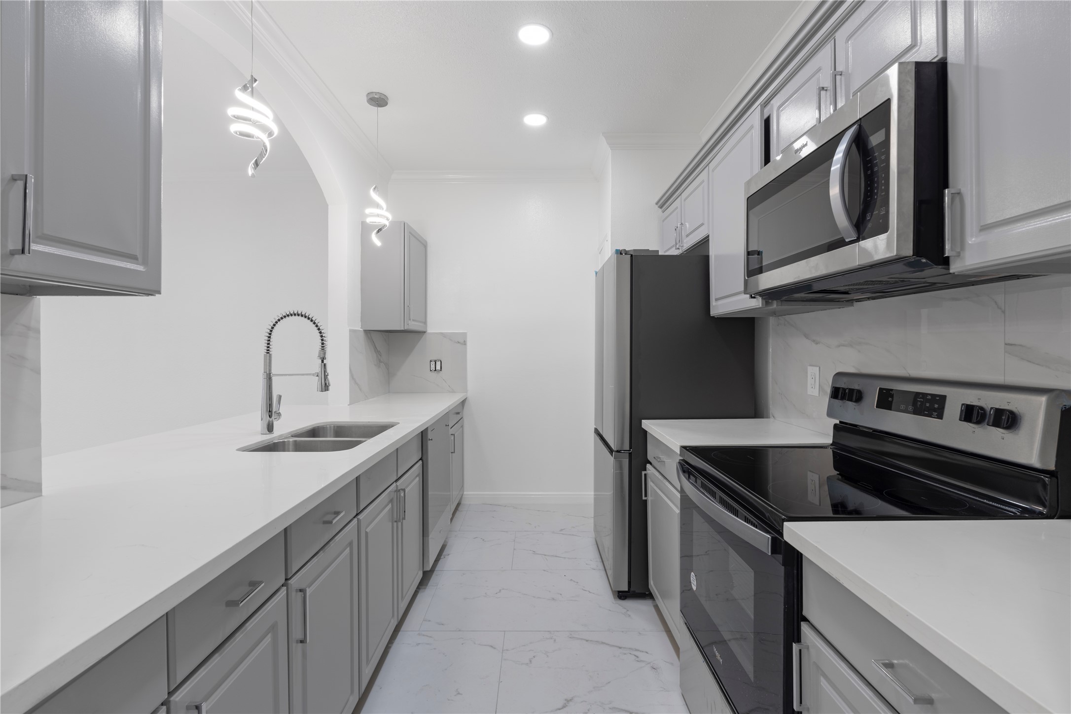 6000 Reims Road, Unit 2005 Houston, TX 77036 - Photo 4 of 28 a kitchen with stainless steel appliances granite countertop a sink stove and refrigerator