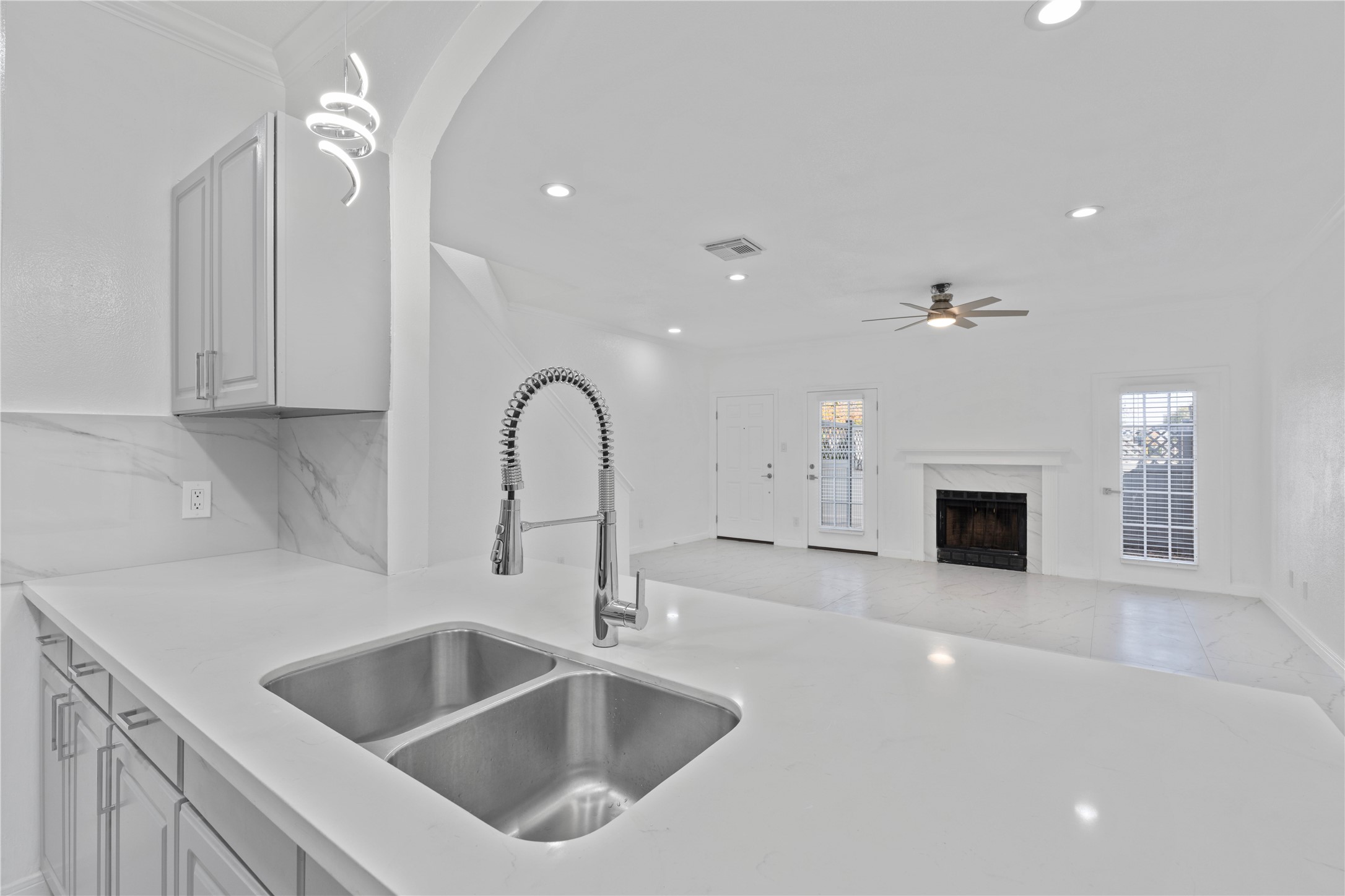 6000 Reims Road, Unit 2005 Houston, TX 77036 - Photo 7 of 28 a kitchen with a sink and a fireplace