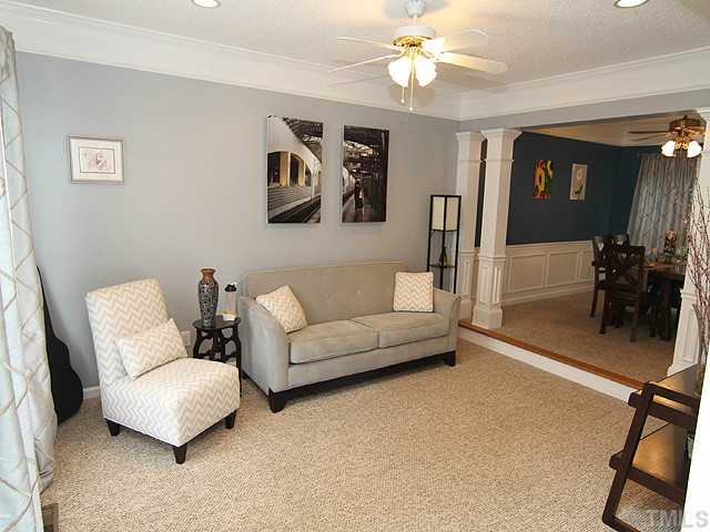 9805 Goodrum Court Raleigh, NC 27617 - Photo 2 of 17 This is a well appointed space that has hanging artwork displayed to offer the style and elegance of this room.