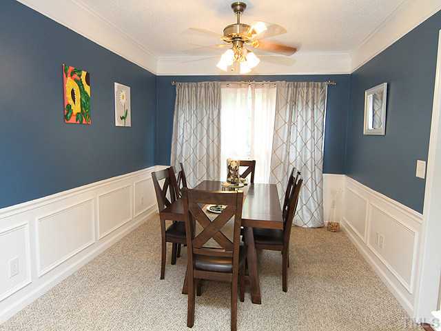 9805 Goodrum Court Raleigh, NC 27617 - Photo 3 of 17 The formal dining area is ready for the meaningful dinners to be served here and the memories to be gathered.