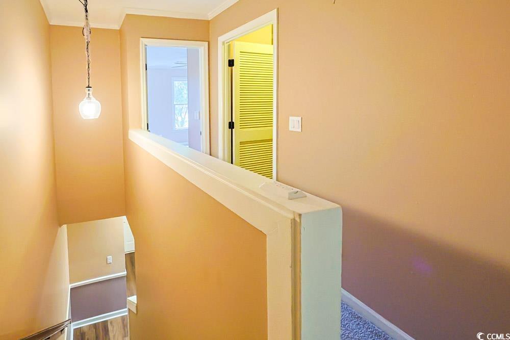 4840 Moss Creek Loop, Unit 3 Murrells Inlet, SC 29576 - Photo 11 of 40 Staircase featuring crown molding and baseboards