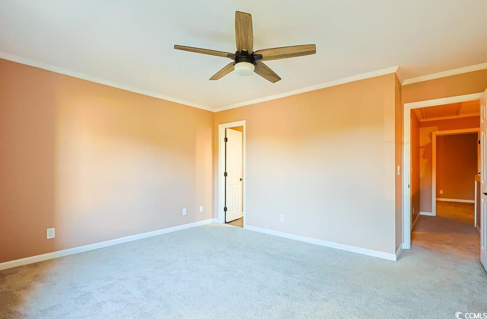 4840 Moss Creek Loop, Unit 3 Murrells Inlet, SC 29576 - Photo 22 of 40 Spare room with ornamental molding, light colored carpet, and ceiling fan