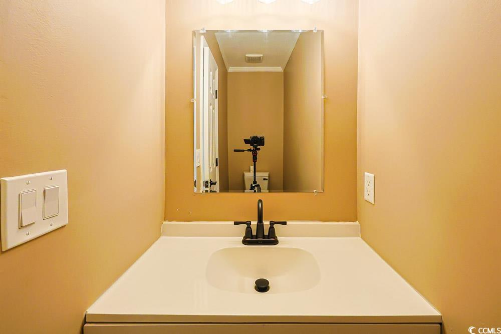 4840 Moss Creek Loop, Unit 3 Murrells Inlet, SC 29576 - Photo 28 of 40 Half bathroom featuring vanity and toilet