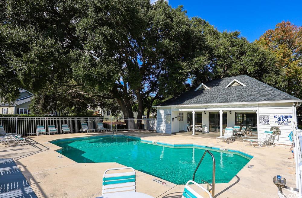 4840 Moss Creek Loop, Unit 3 Murrells Inlet, SC 29576 - Photo 33 of 40 Community pool featuring a patio
