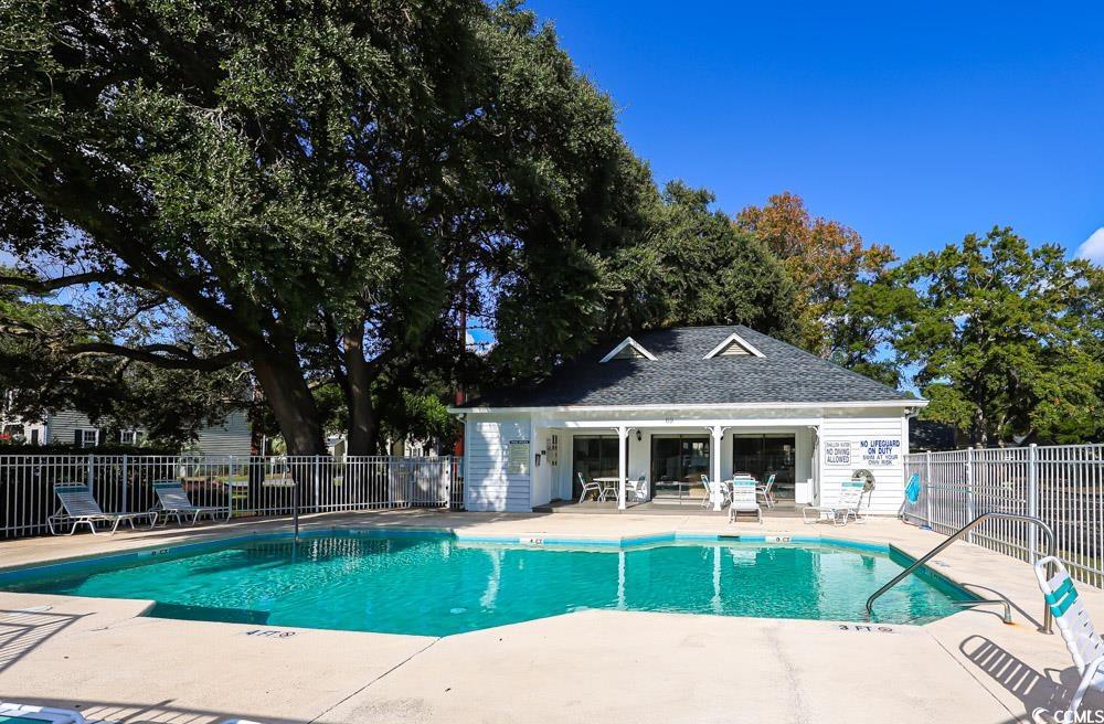 4840 Moss Creek Loop, Unit 3 Murrells Inlet, SC 29576 - Photo 34 of 40 Community pool with a patio area