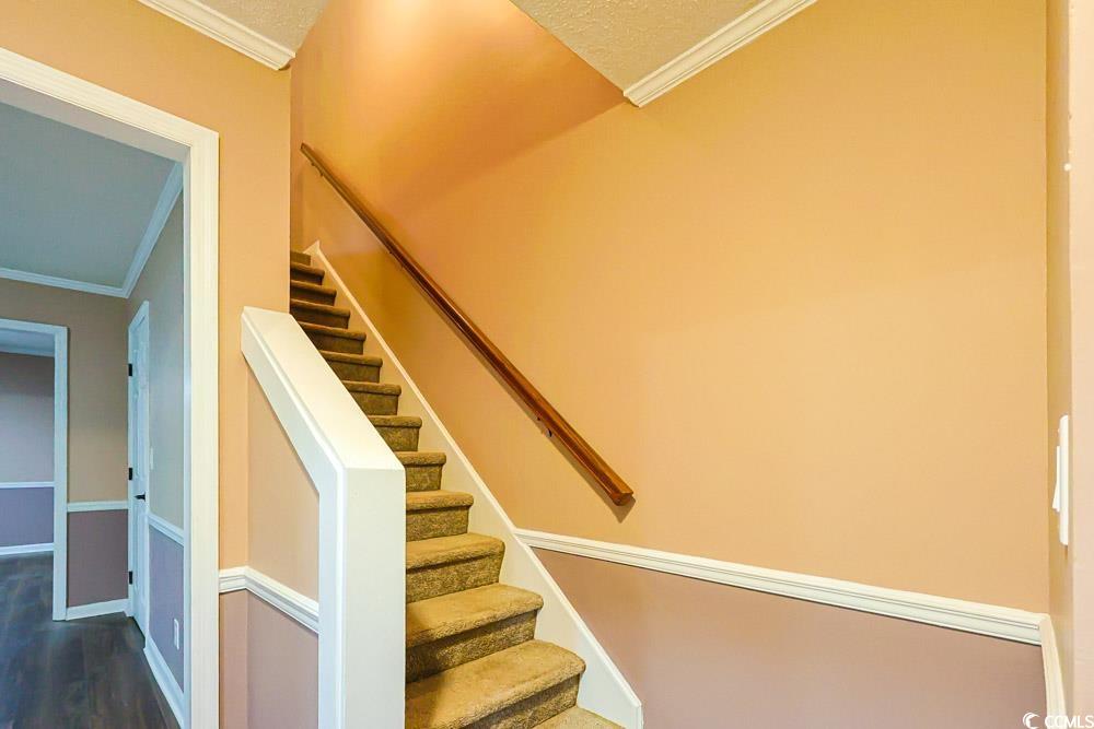 4840 Moss Creek Loop, Unit 3 Murrells Inlet, SC 29576 - Photo 10 of 40 Stairs with ornamental molding and wood finished floors