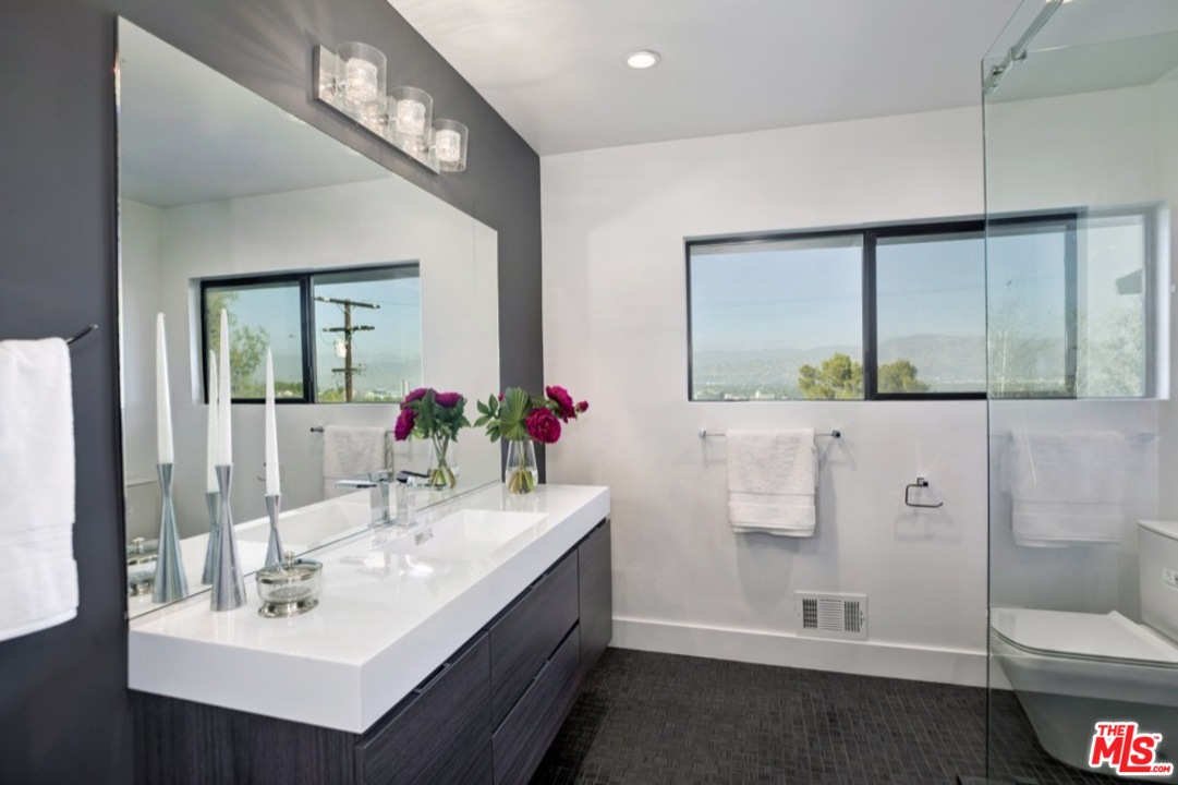 3712 Berry Drive Studio City, CA 91604 - Photo 15 of 50 a bathroom with a sink and a mirror
