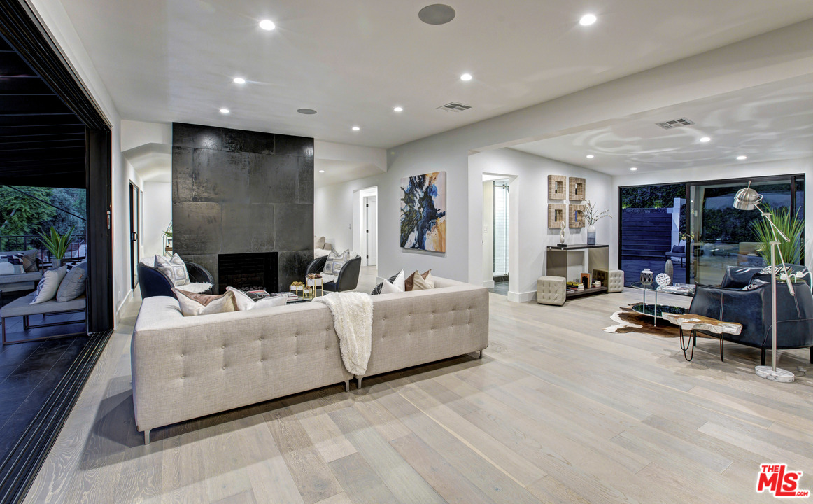 3712 Berry Drive Studio City, CA 91604 - Photo 3 of 50 a living room with furniture and a flat screen tv