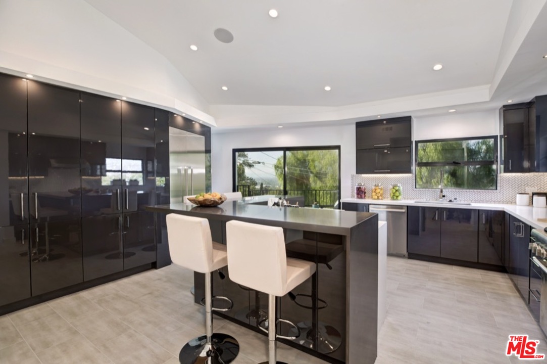 3712 Berry Drive Studio City, CA 91604 - Photo 4 of 50 a kitchen with a table and chairs in it