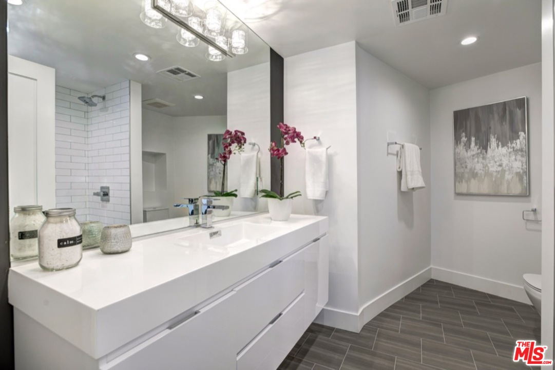 3712 Berry Drive Studio City, CA 91604 - Photo 40 of 50 a bathroom with a sink vanity and a mirror