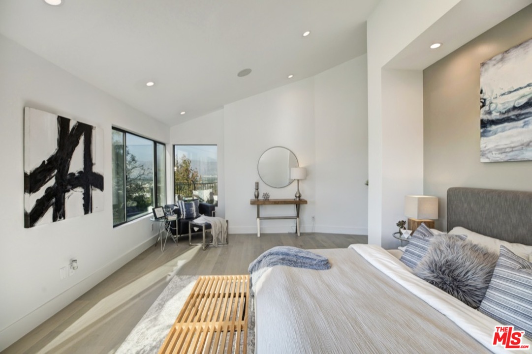 3712 Berry Drive Studio City, CA 91604 - Photo 8 of 50 a bedroom with a bed and wooden floor