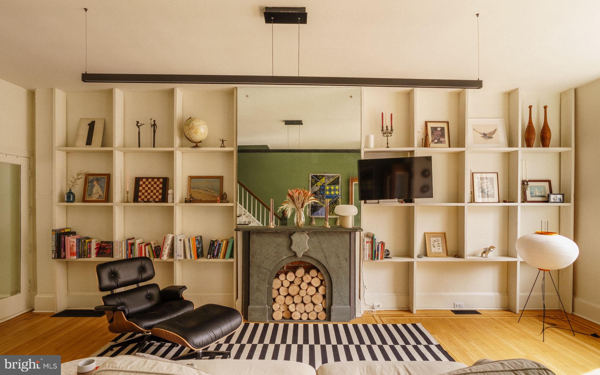 1335 Reed Street Philadelphia, PA 19147 - Photo 2 of 72 a living room with a couch and a potted plant
