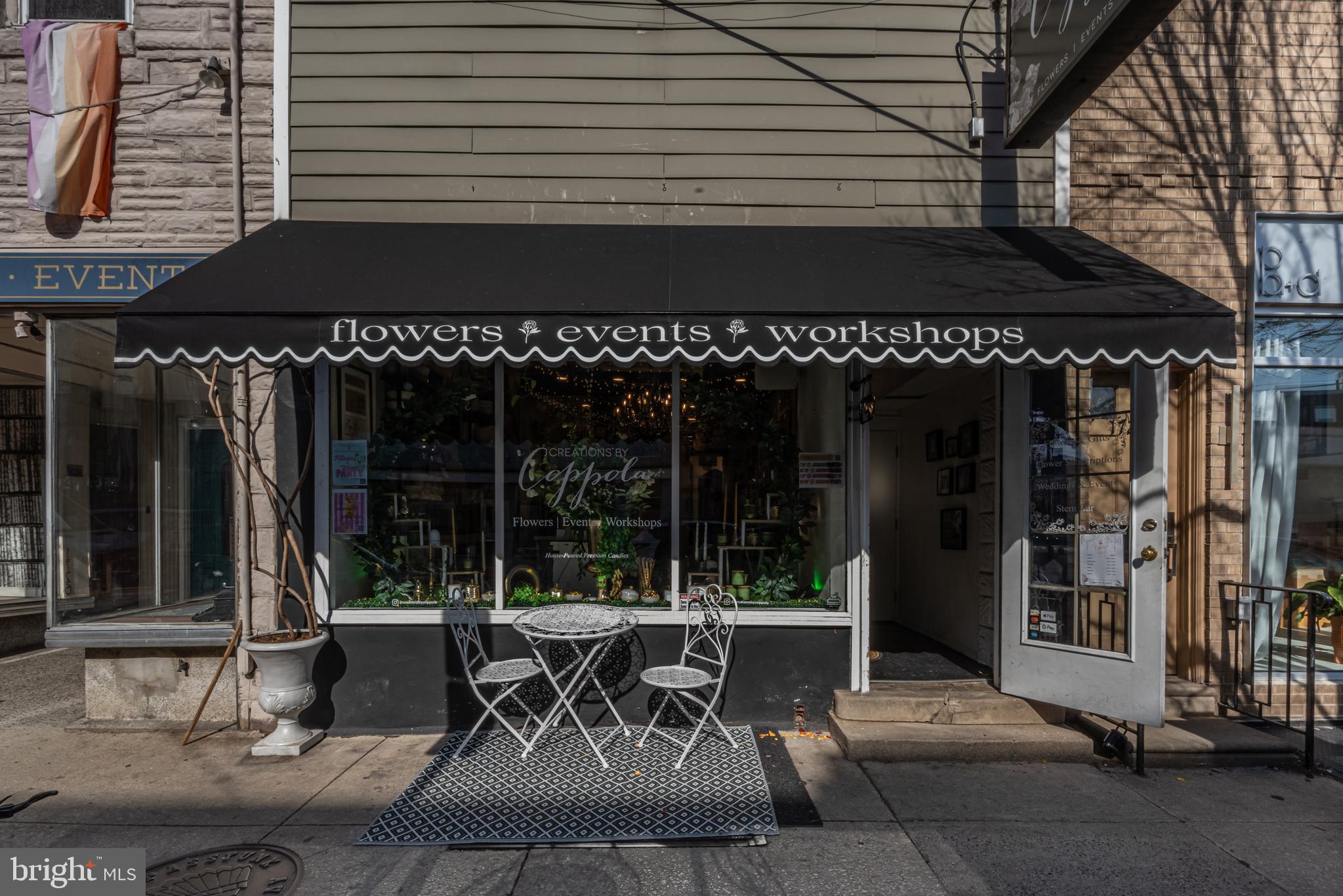 1335 Reed Street Philadelphia, PA 19147 - Photo 62 of 72 a view of a patio with a table and chairs and floor to ceiling window