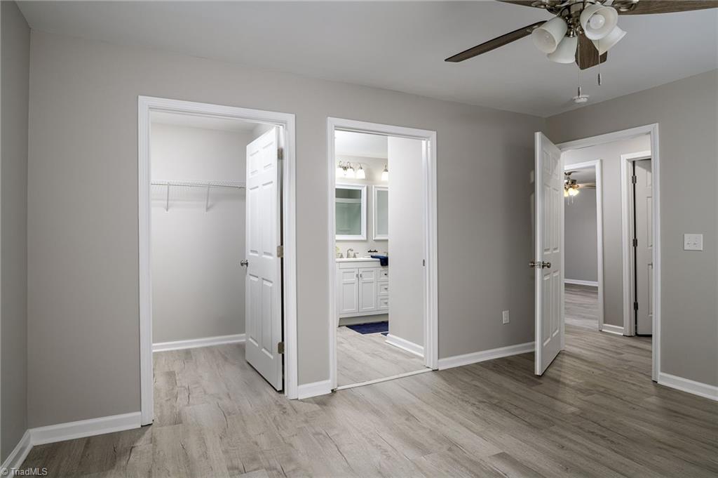 5425 Davis Road Walkertown, NC 27051 - Photo 17 of 39 Primary bedroom with ensuite bath and walk in closet