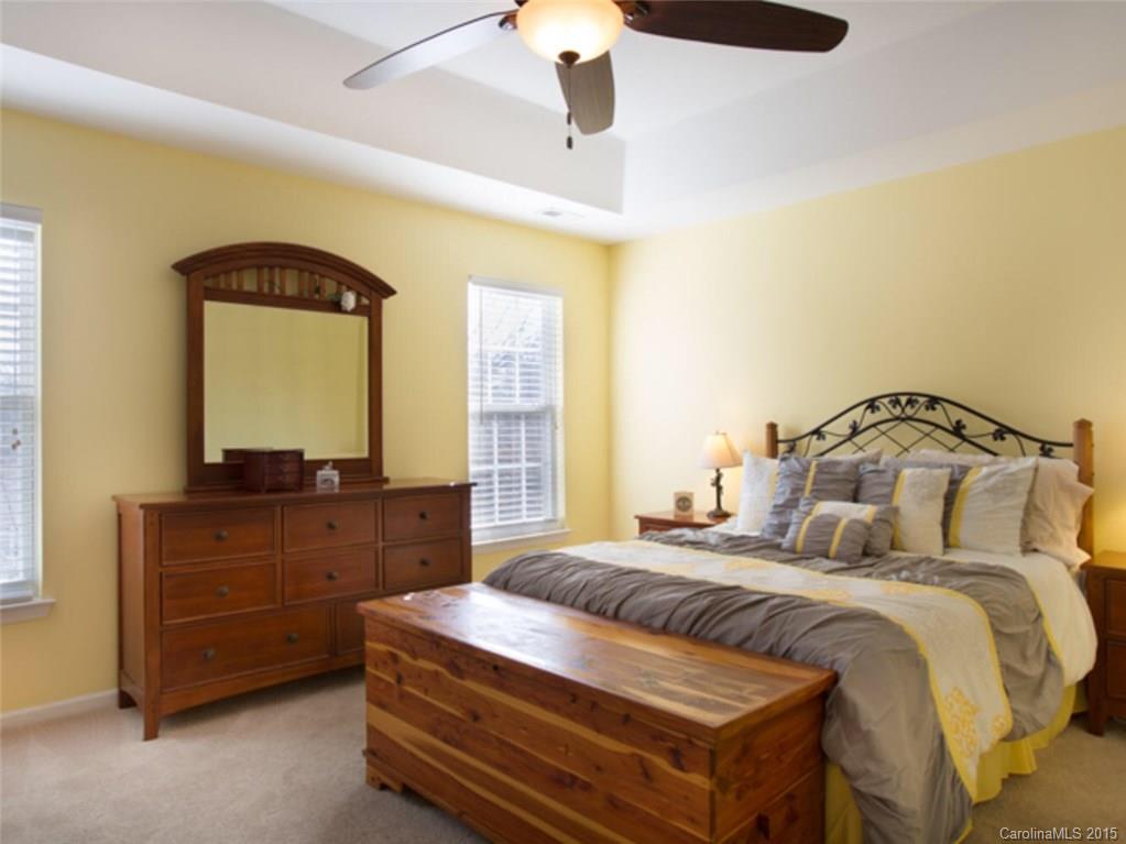 866 Knightsbridge Road Fort Mill, SC 29708 - Photo 8 of 19 a bedroom with a bed and a mirror on dresser