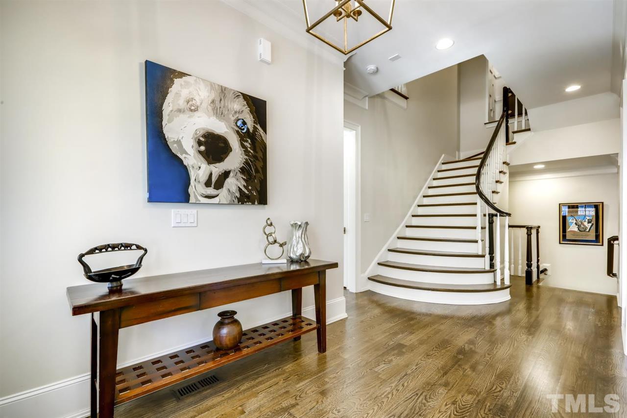 2827 Lewis Farm Road Raleigh, NC 27607 - Photo 2 of 30 10 Foot Ceilings, Pristine Hardwoods, Rounded Staircase and Custom Molding Invite You into this Gracious Home.