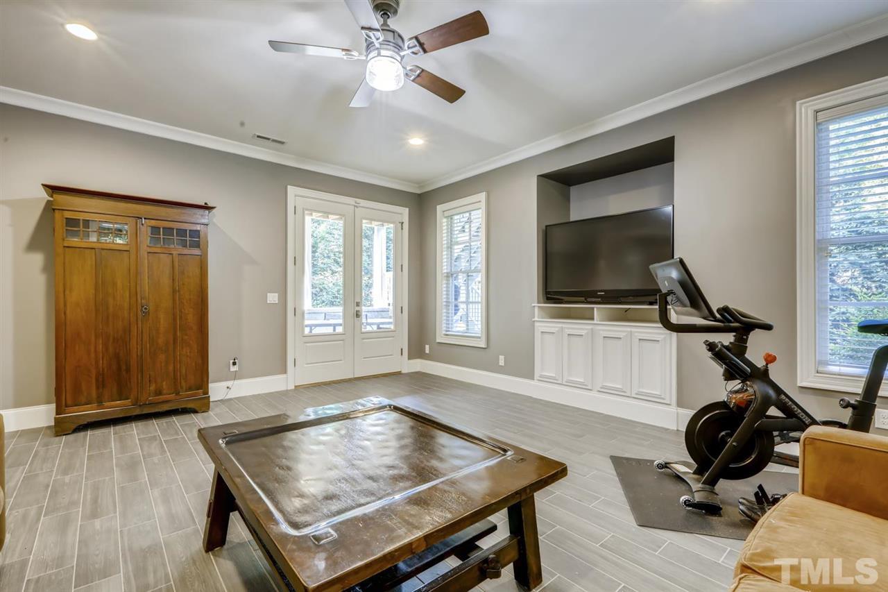 2827 Lewis Farm Road Raleigh, NC 27607 - Photo 17 of 30 Room for Lounging, Exercising, Crafting, Gaming - you name it - access the Patio from the Double French Doors.
