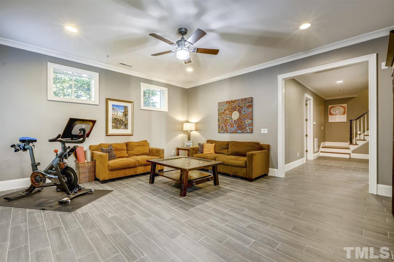2827 Lewis Farm Road Raleigh, NC 27607 - Photo 18 of 30 Love The Transom Windows and 10 Foot Ceilings in this Basement Retreat!