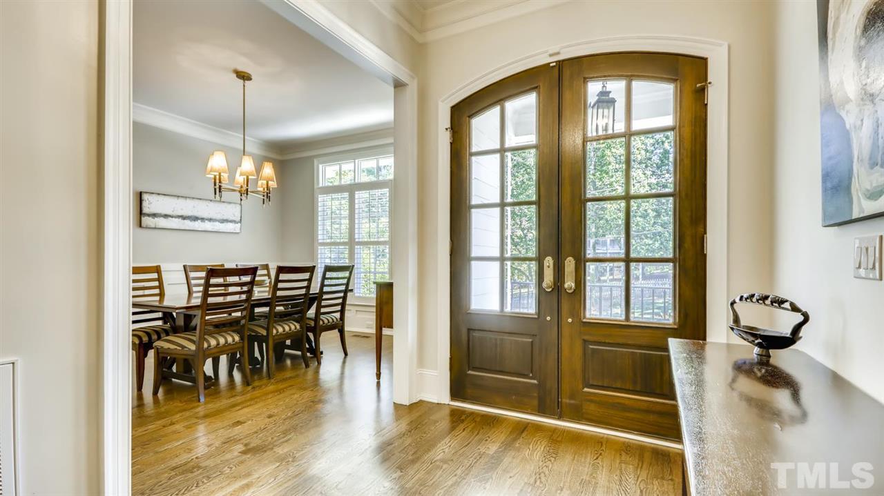 2827 Lewis Farm Road Raleigh, NC 27607 - Photo 3 of 30 Solid Wood Double Doors Bring You in from the Covered Flagstone Front Porch.