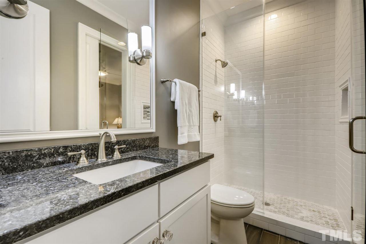 2827 Lewis Farm Road Raleigh, NC 27607 - Photo 21 of 30 Access from Hall or Bedroom - Marble Tile Floor in Walk-In Shower - Tile to the Ceiling!