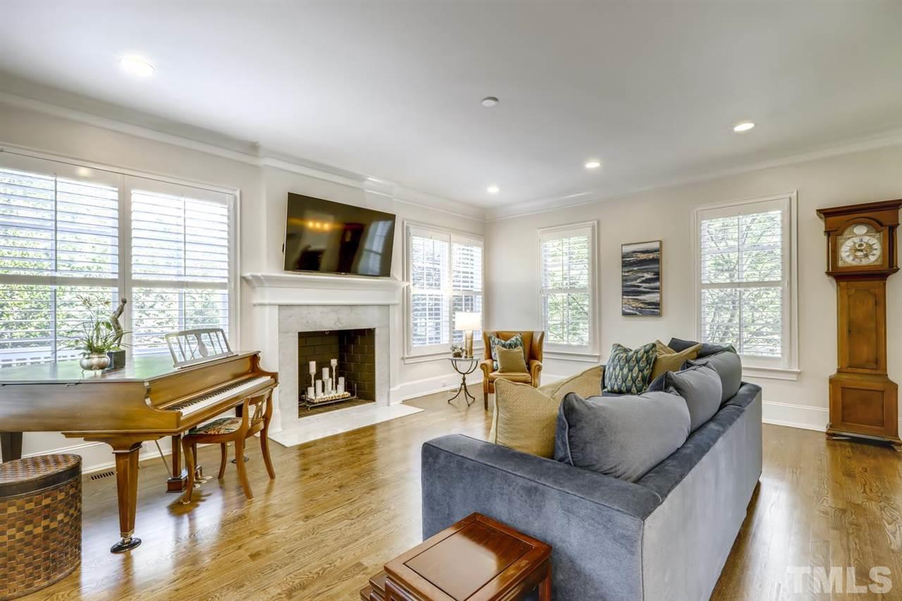 2827 Lewis Farm Road Raleigh, NC 27607 - Photo 5 of 30 Surrounded by Windows, Anchored by a Huge Marble Fireplace, and Open to the Kitchen