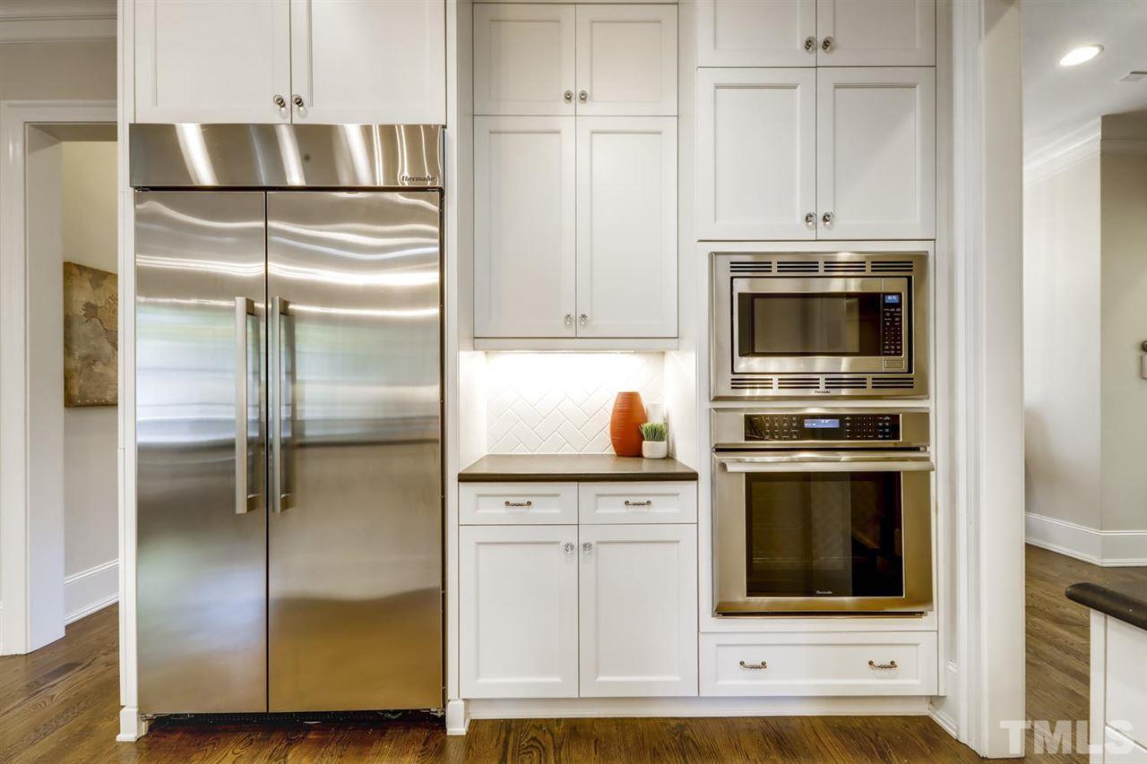 2827 Lewis Farm Road Raleigh, NC 27607 - Photo 9 of 30 Built-In Fridge and Cabinets to the Ceiling - so much useful space!