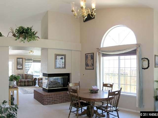5860 Mitra Way Reno, NV 89523 - Photo 2 of 5 a view of a dining room with furniture window and outside view