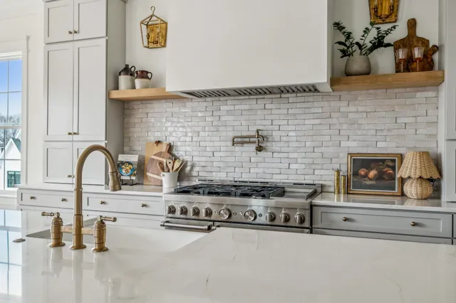 a kitchen with a stove and a sink
