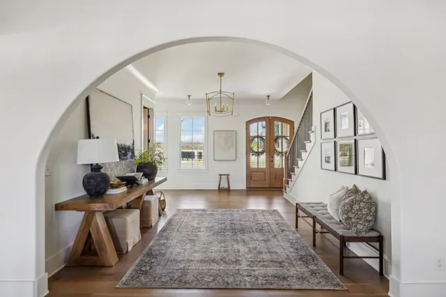 a living room with furniture and a rug