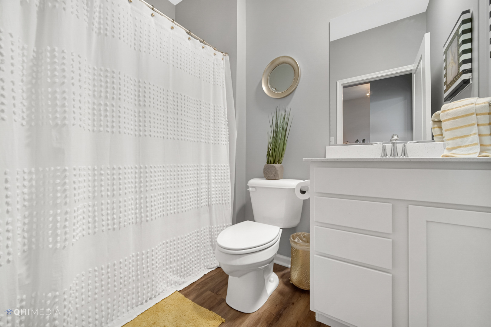 16017 Longcommon Lane Plainfield, IL 60586 - Photo 18 of 22 a bathroom with a toilet a sink and a mirror