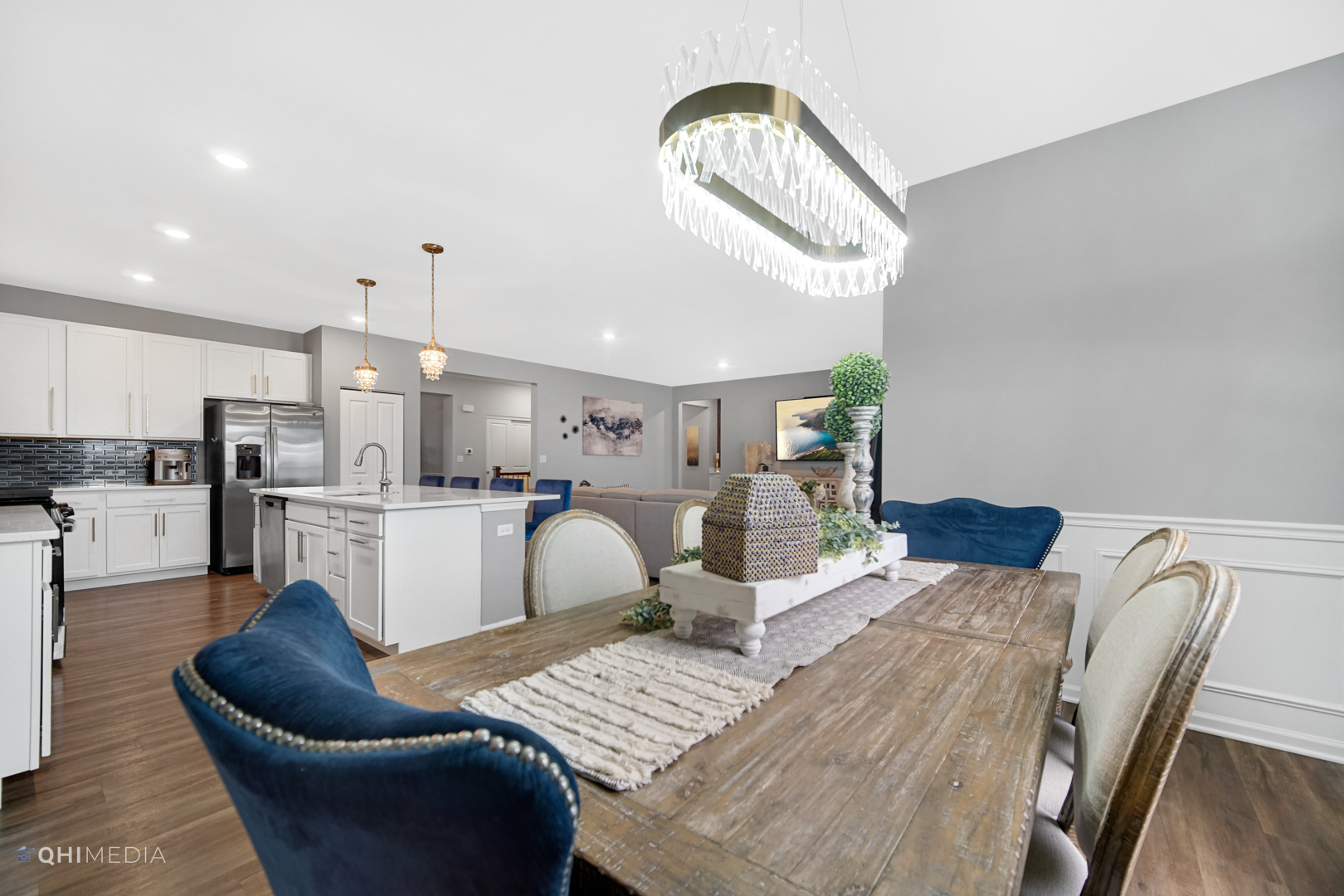 16017 Longcommon Lane Plainfield, IL 60586 - Photo 8 of 22 a living room with furniture and a chandelier