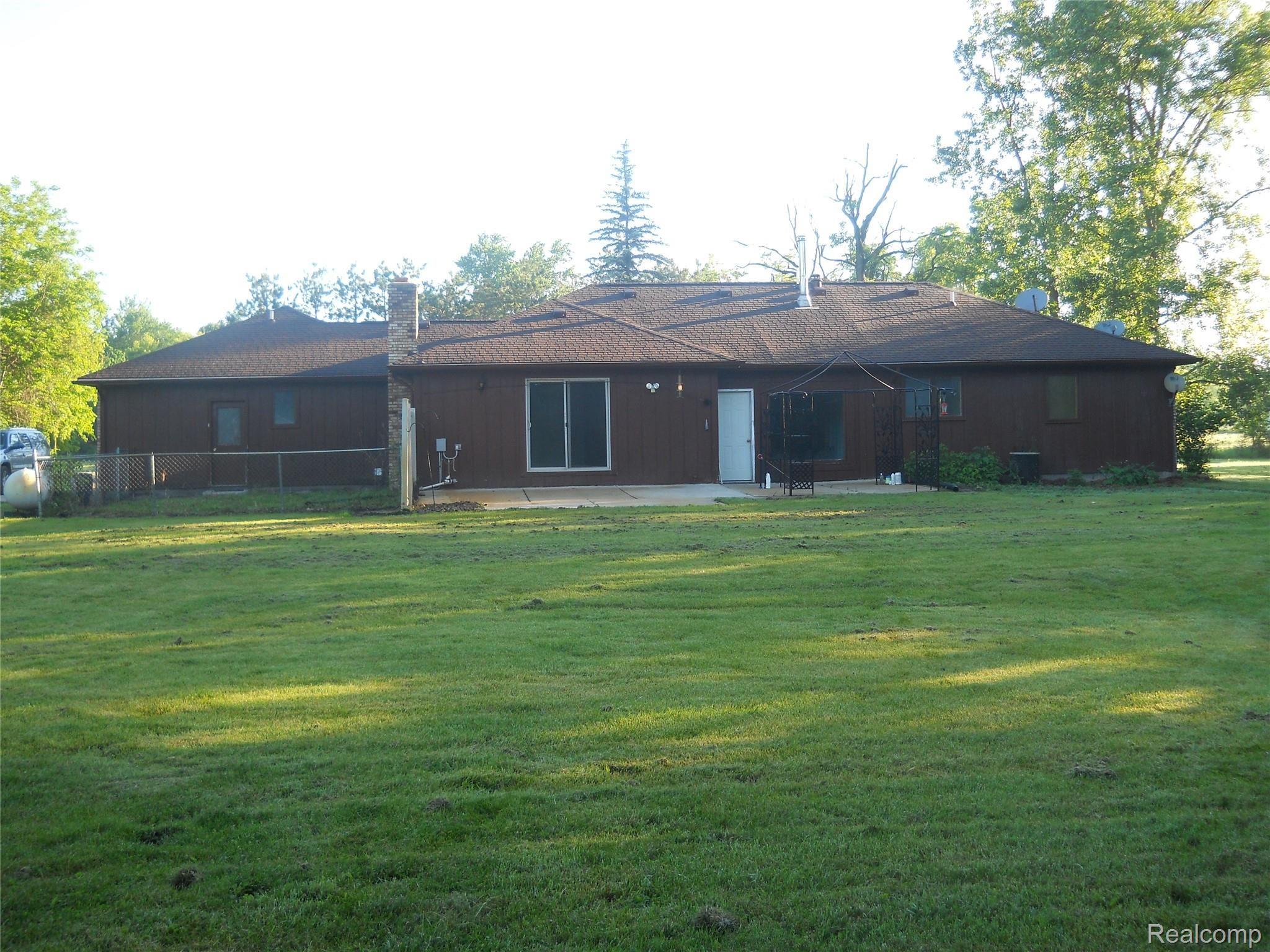 5929 Layton Road Fowlerville, MI 48836 - Photo 2 of 24 Layton rear