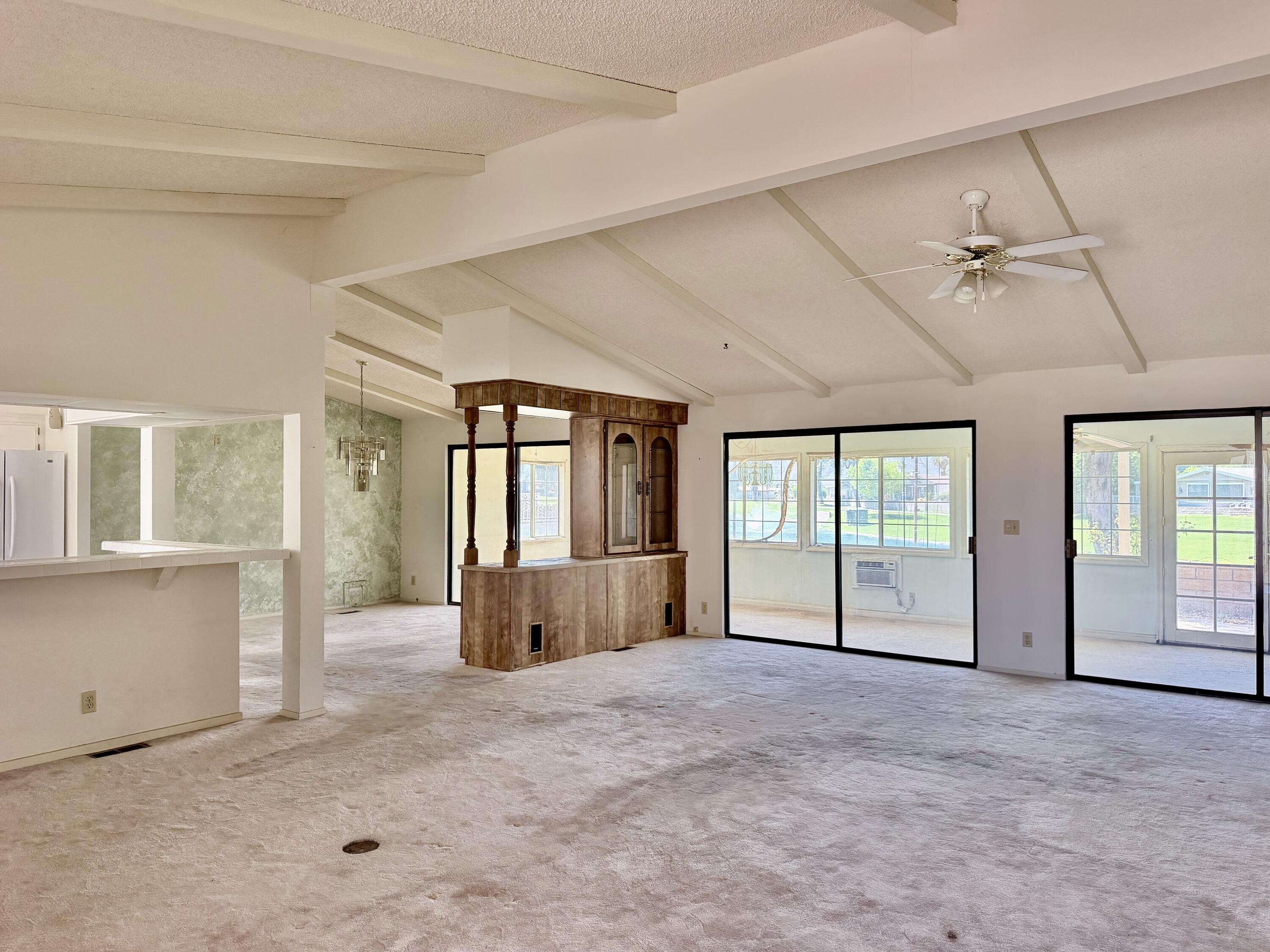 74361 Angel Camp Road Palm Desert, CA 92260 - Photo 8 of 12 a view of an empty room with a window