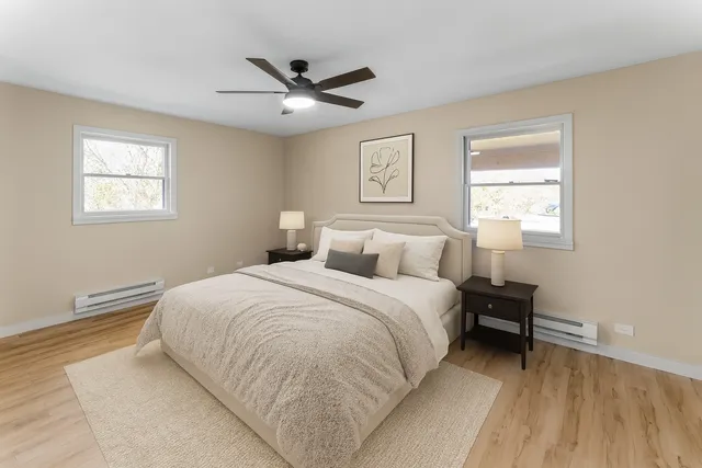 a bedroom with a bed and a window