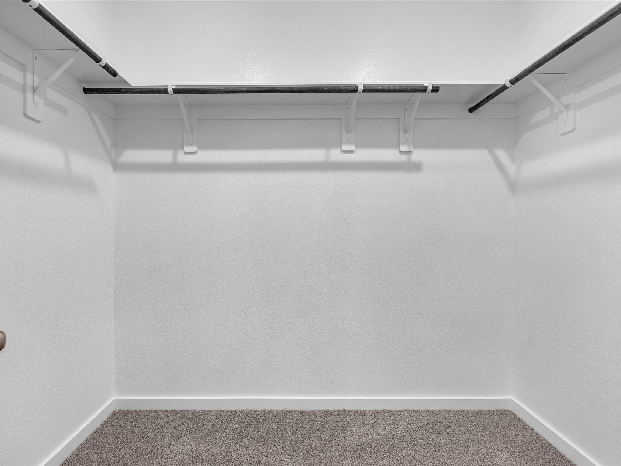 1749 Succotash Oak Court Conroe, TX 77304 - Photo 14 of 21 a view of a room with racks on the wall