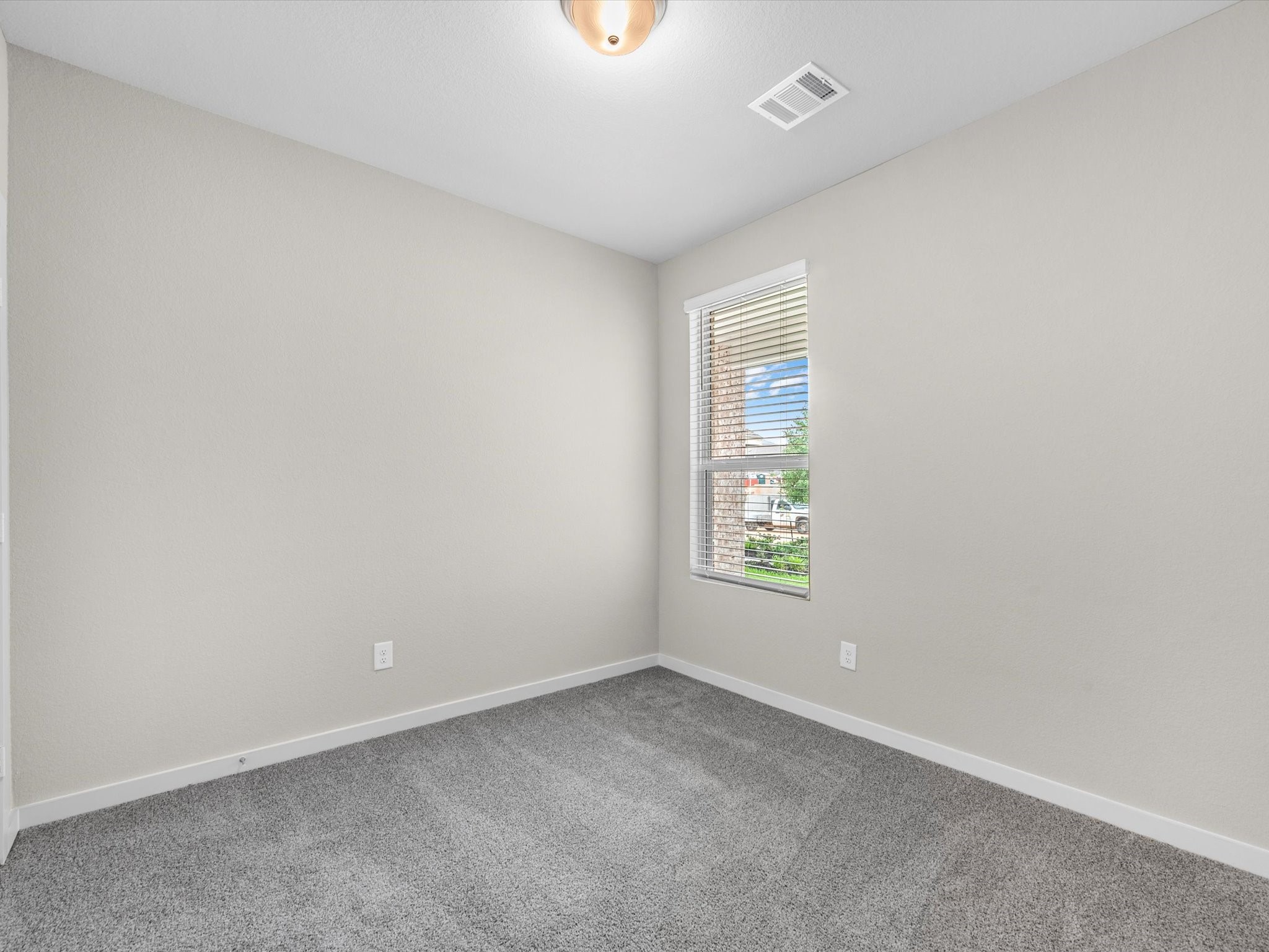 1749 Succotash Oak Court Conroe, TX 77304 - Photo 15 of 21 an empty room with windows