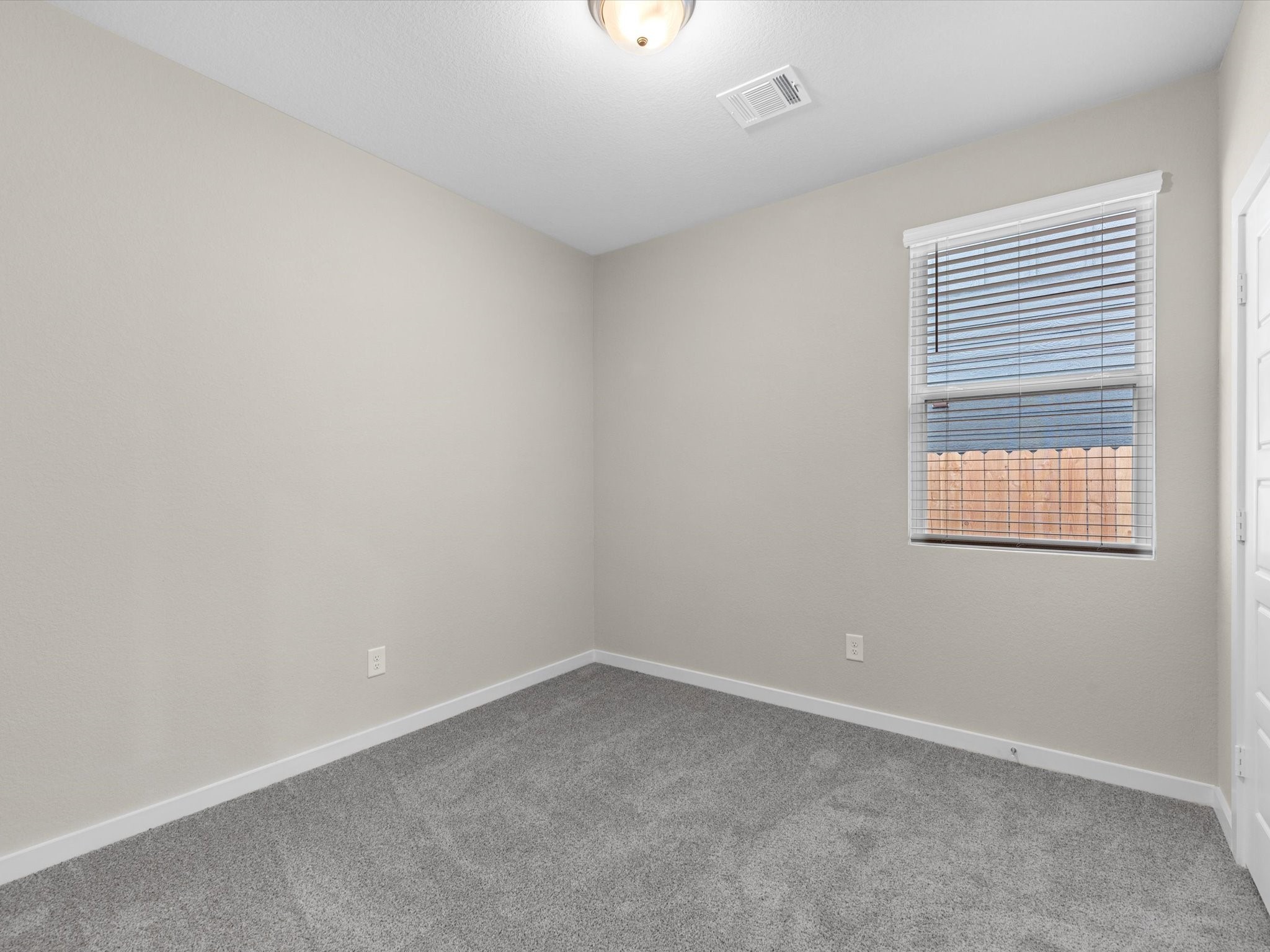 1749 Succotash Oak Court Conroe, TX 77304 - Photo 16 of 21 an empty room with a window