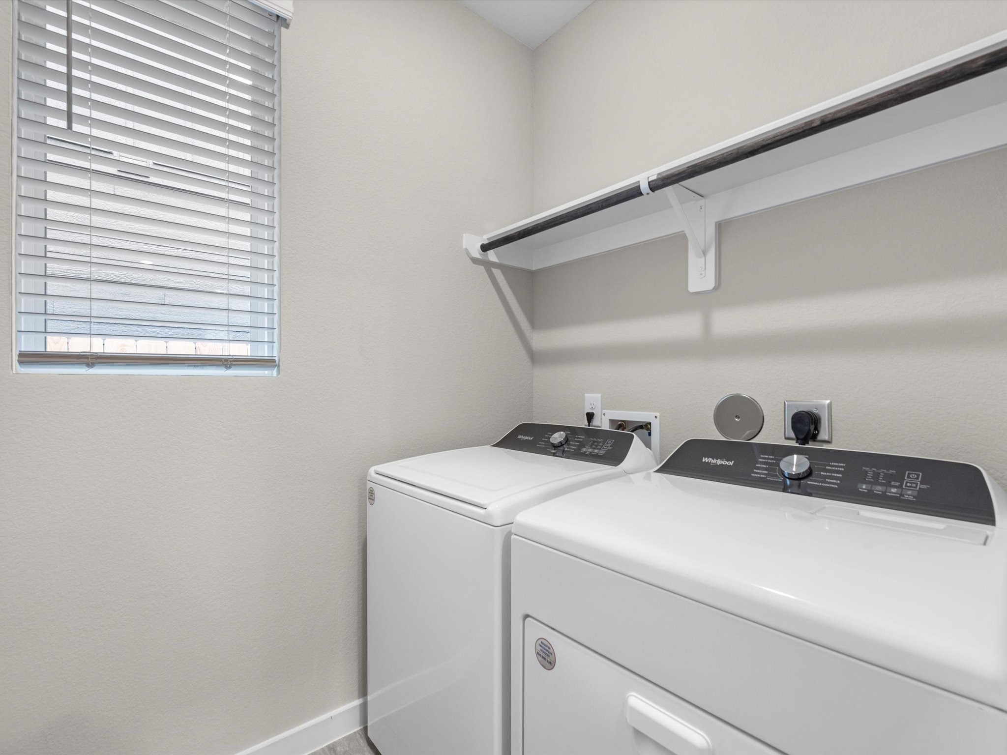 1749 Succotash Oak Court Conroe, TX 77304 - Photo 18 of 21 a utility room with dryer and washer