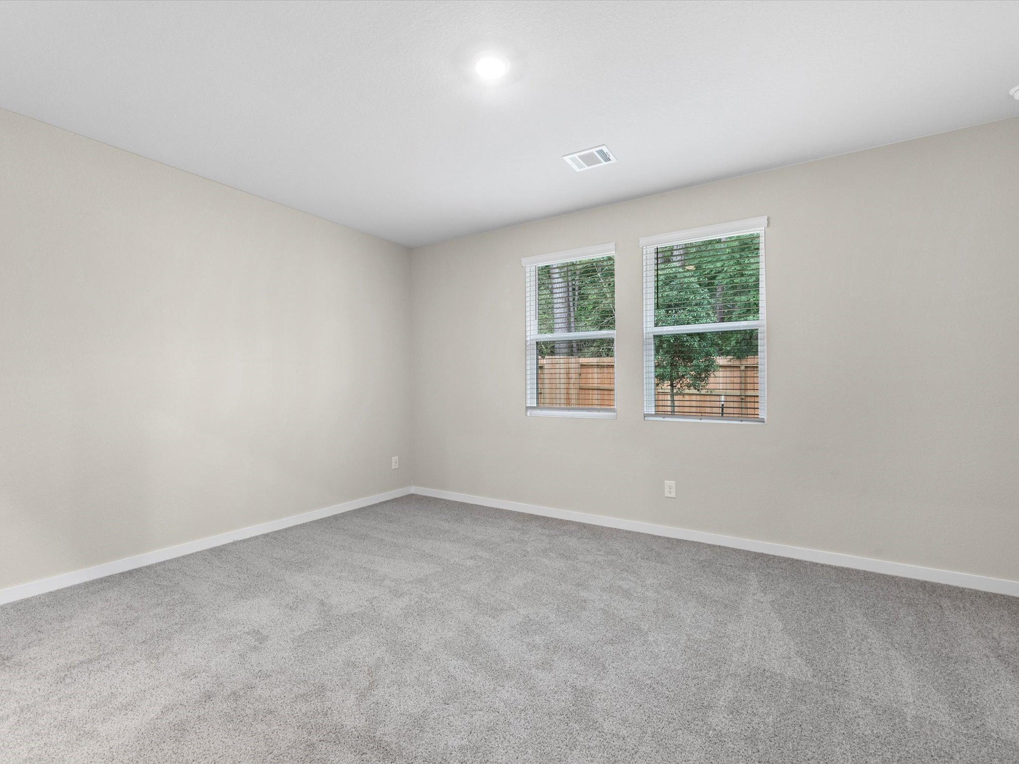 1749 Succotash Oak Court Conroe, TX 77304 - Photo 10 of 21 an empty room with windows