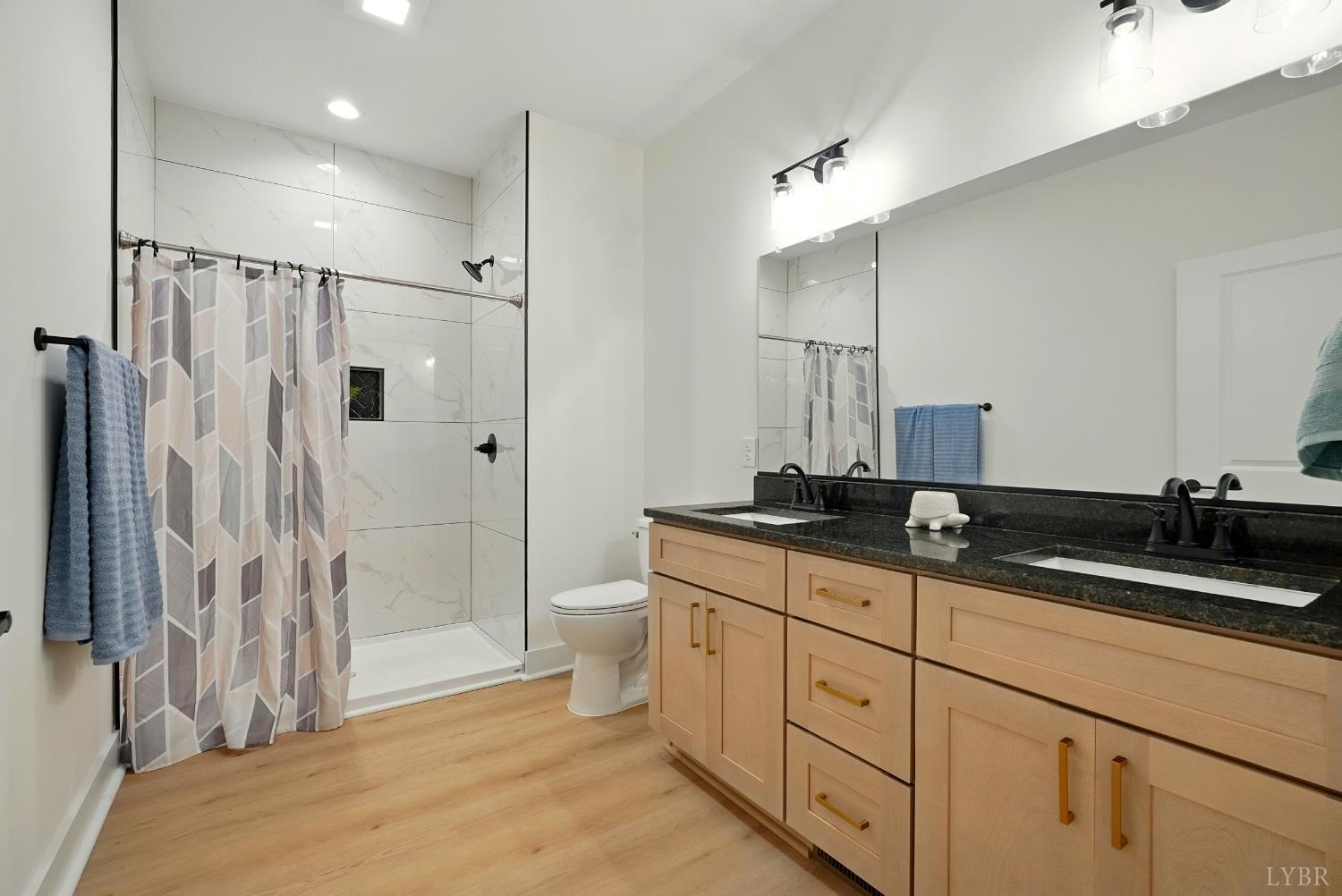 1 Golf Club Road Danville, VA 24540 - Photo 22 of 33 a spacious bathroom with double sink and a shower