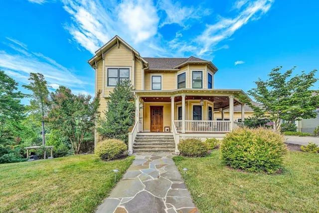 a kitchen with granite countertop white cabinets and a window