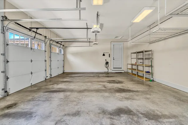 a view of an house with backyard and trees