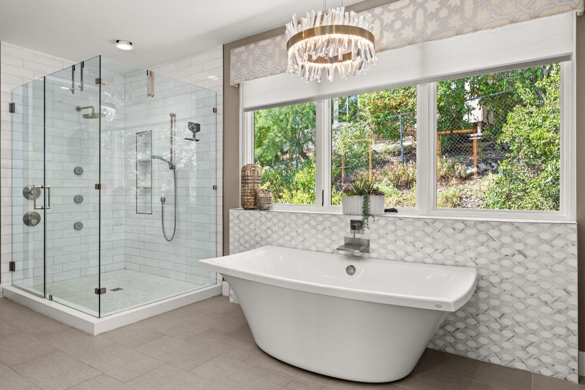 4908 Beverly Skyline Austin, TX 78731 - Photo 21 of 40 Full bathroom featuring a freestanding bath, a shower stall, and light tile patterned floors