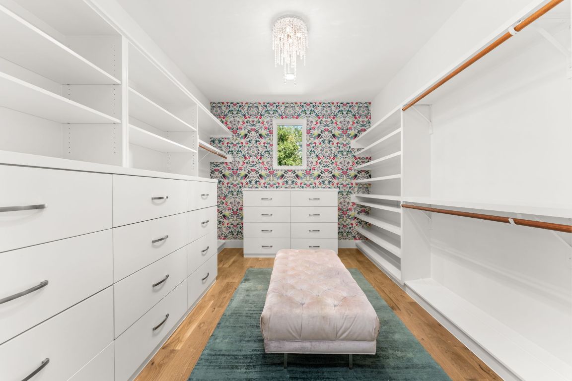 4908 Beverly Skyline Austin, TX 78731 - Photo 22 of 40 Walk in closet featuring light wood-style flooring