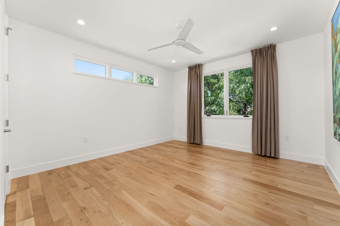 4908 Beverly Skyline Austin, TX 78731 - Photo 31 of 40 Unfurnished room with light wood finished floors, recessed lighting, and a ceiling fan